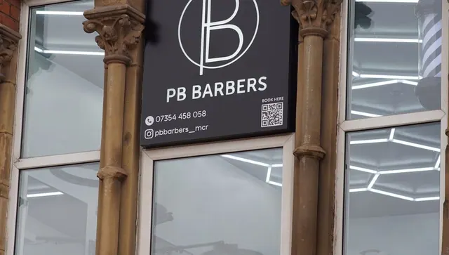 The PB Barbers sign by the entrance